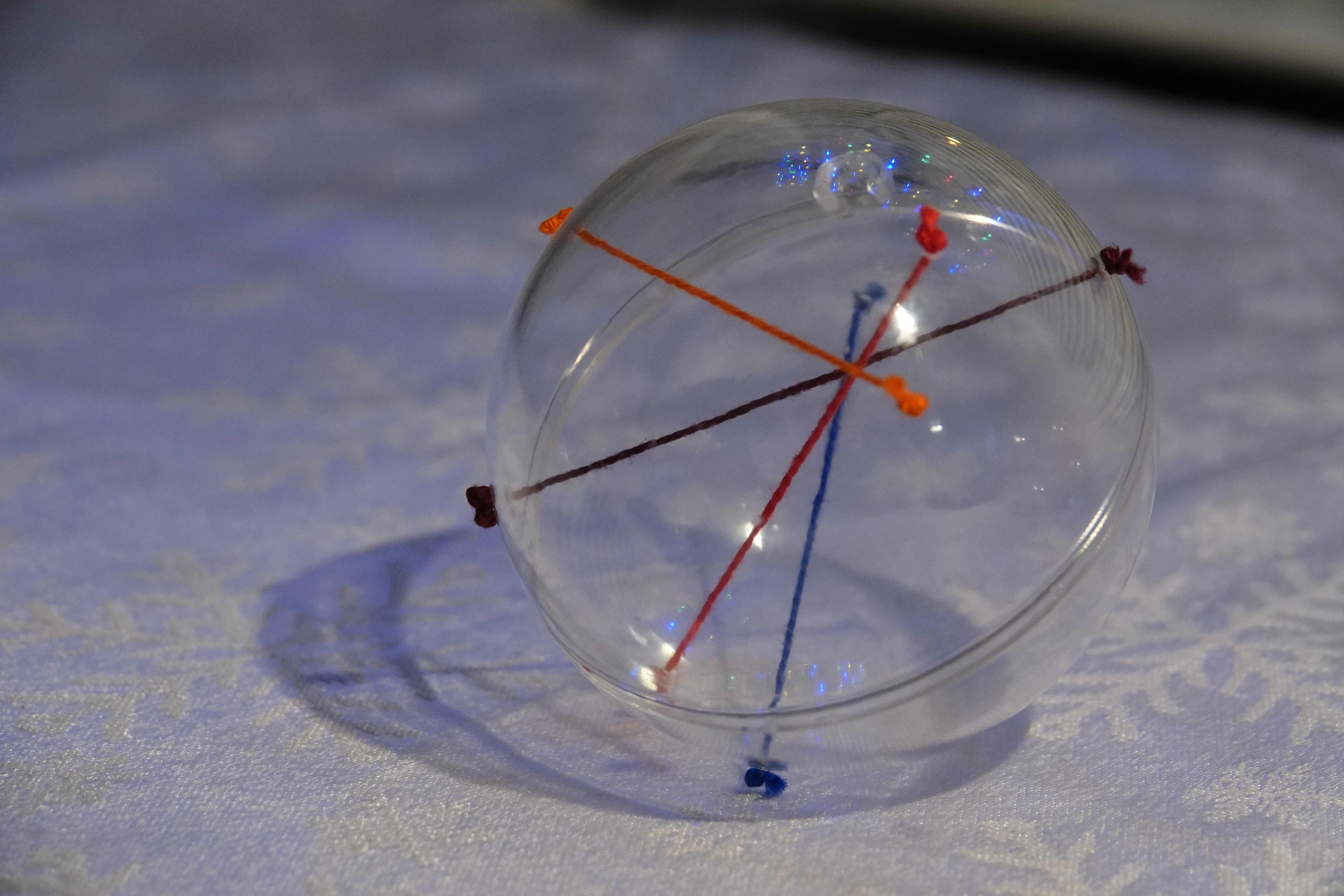 Another view of the bauble where the four strings all cross together into a point.