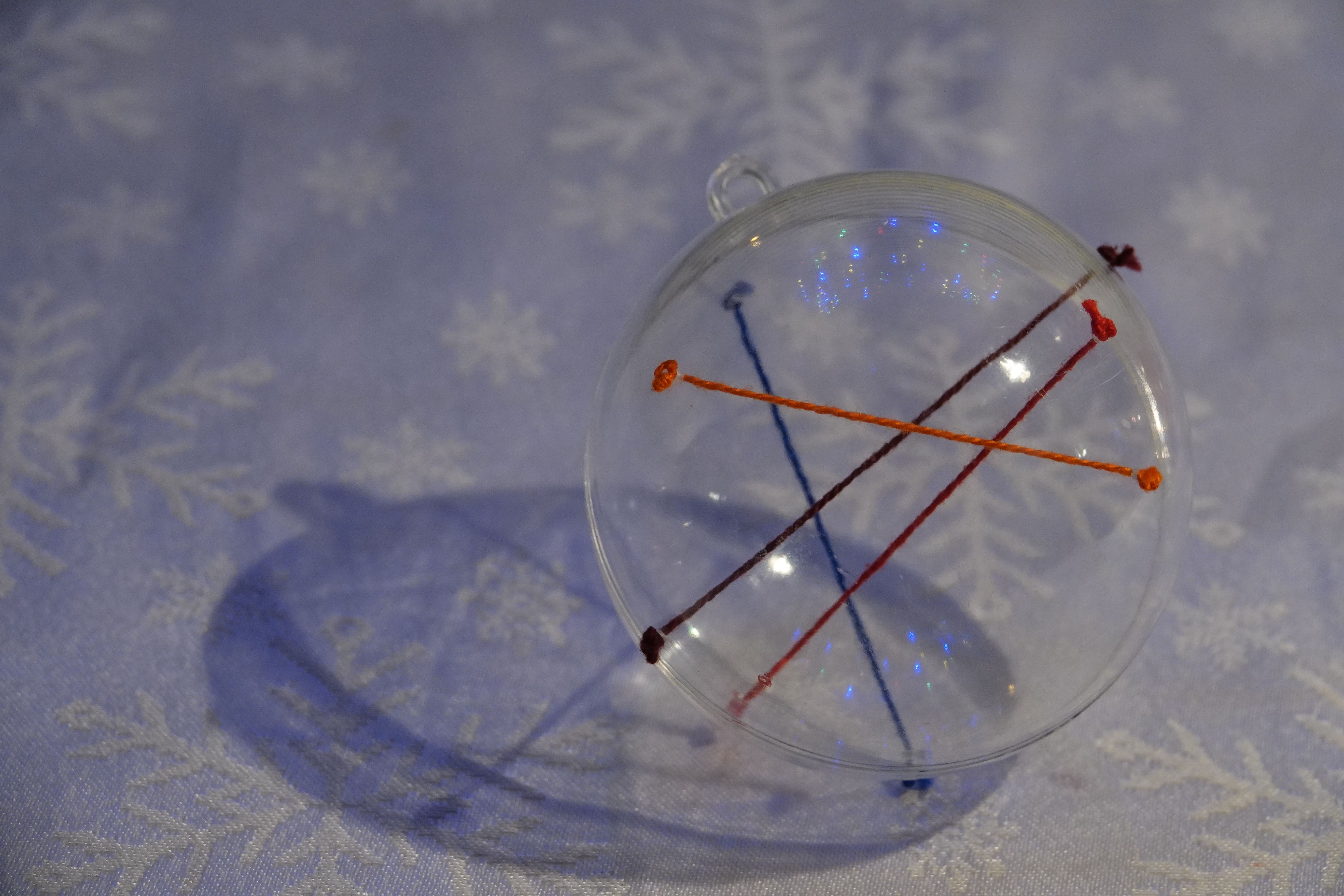 christmas ornament full of four strings