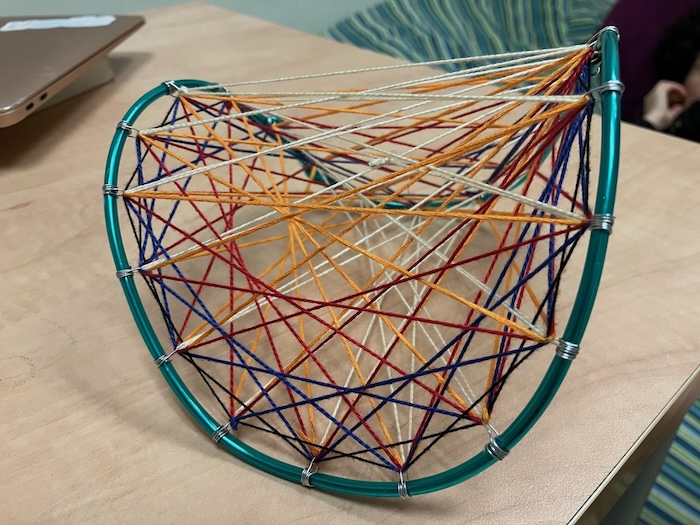 A pringle shape cross hatched by many lines