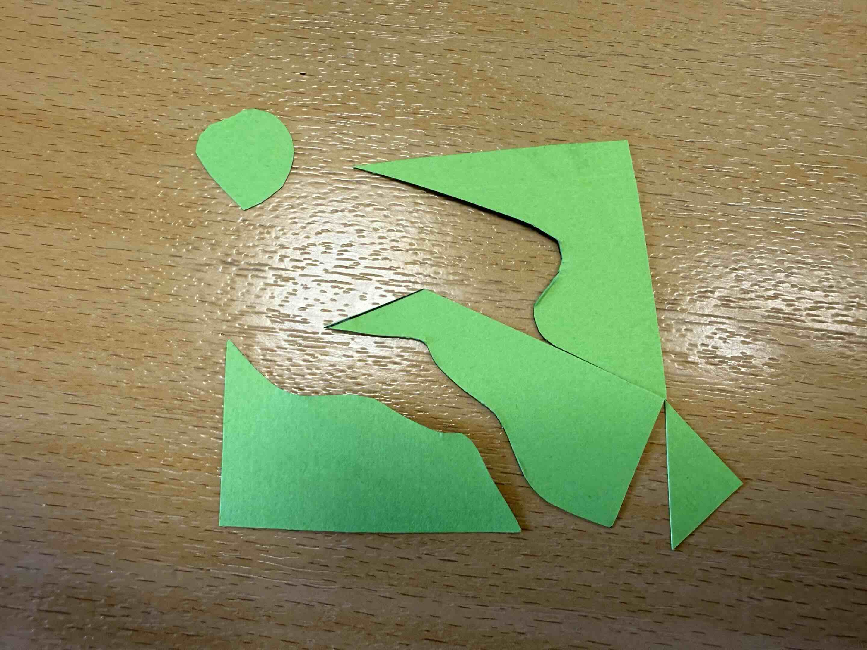 pieces of a  square rearranged into a bird