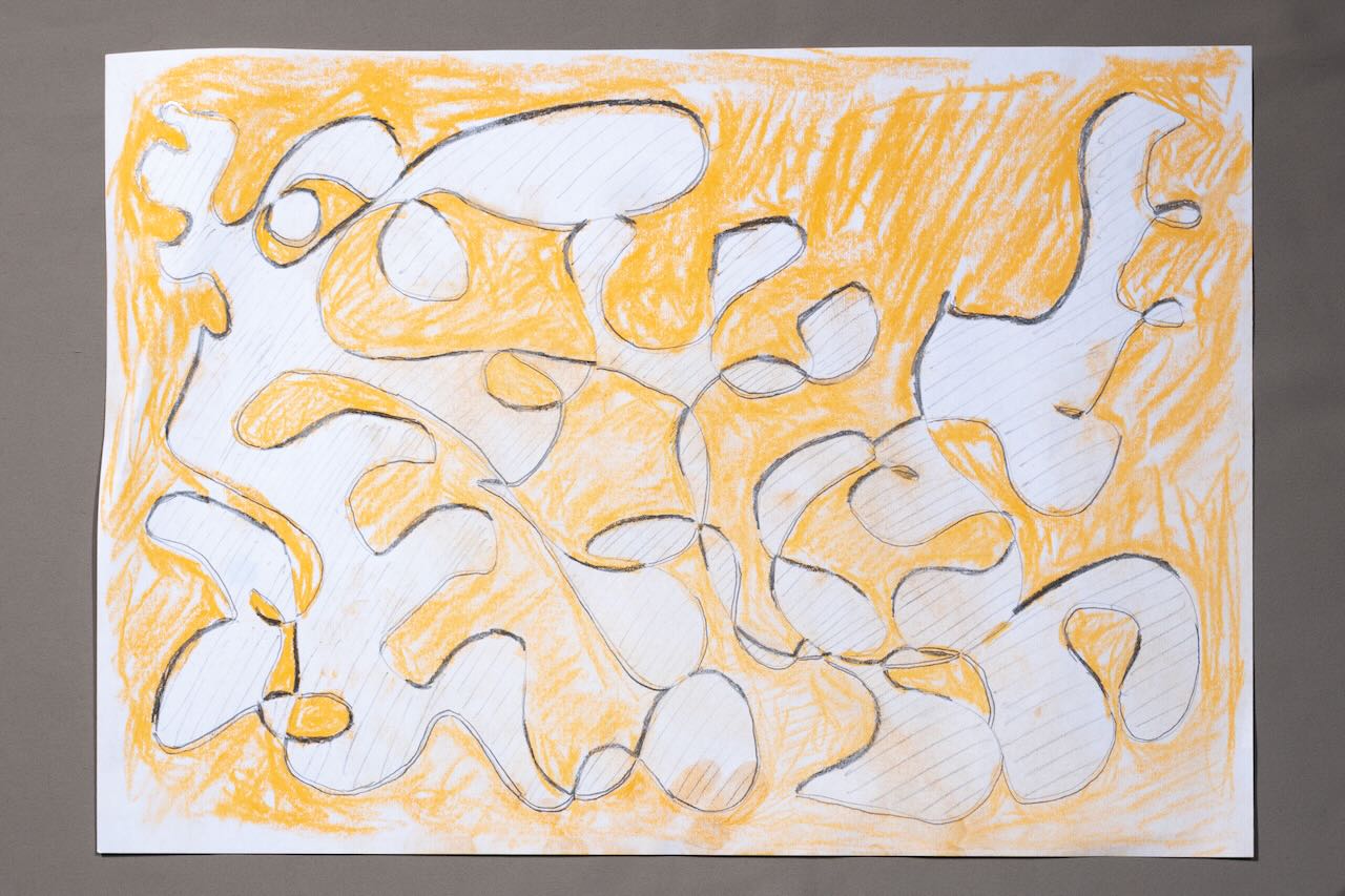 Knot winding around the paper. Every other region is white or orange. There is a black border on one side of the curve