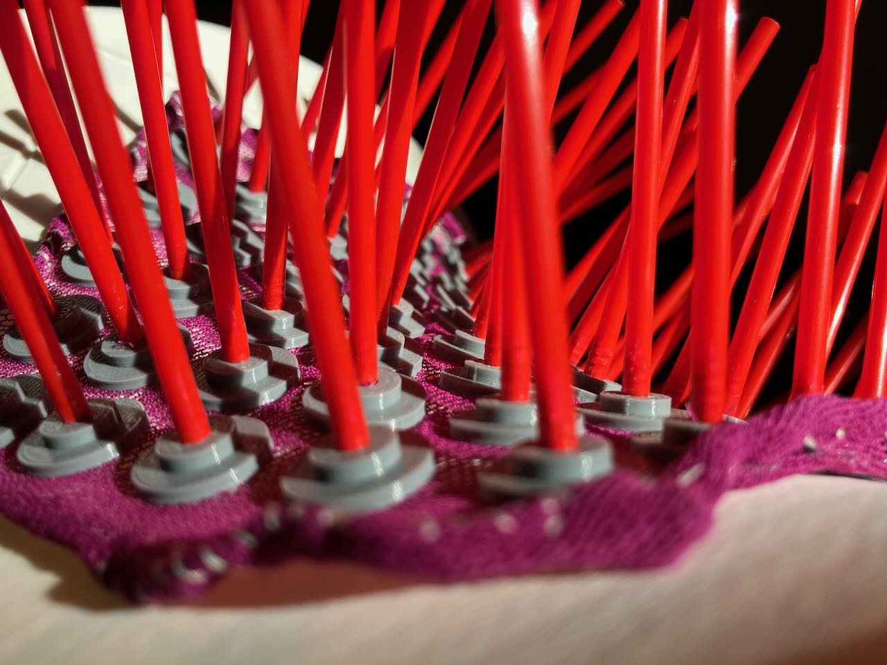 Normal cloth draped over a saddle, looked along a diagonal. It s like a forest, with the trees tilting as you move through