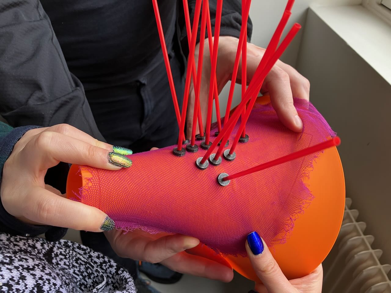 a 3D printer mid print with fabric taped to the print bed.