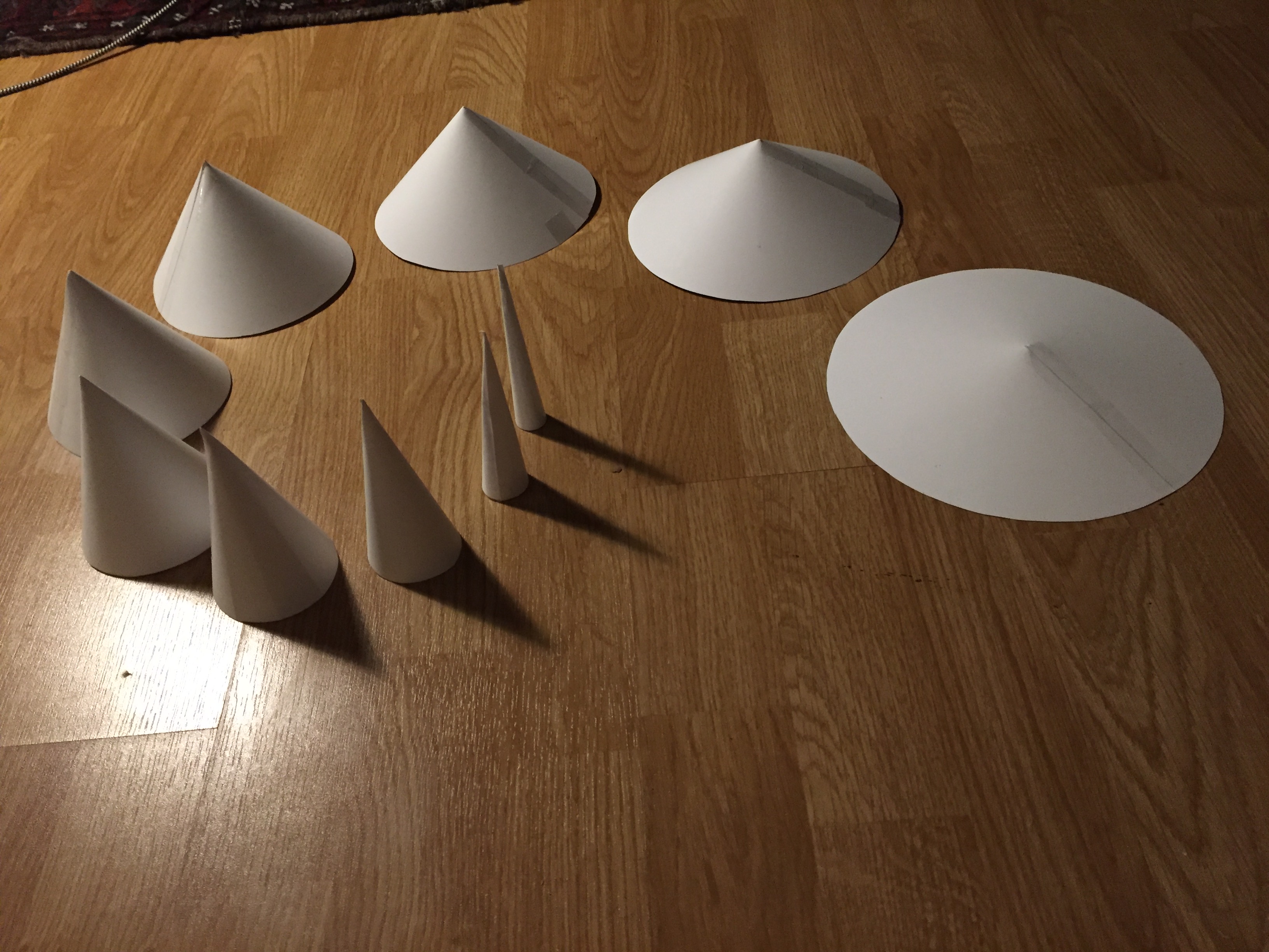 A bunch of paper cones of different slope