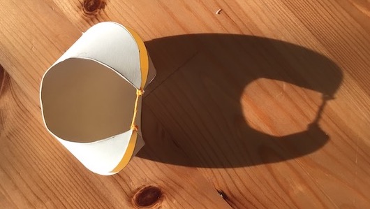 a folded origami vesica piscis. It forms a moon-like shape.