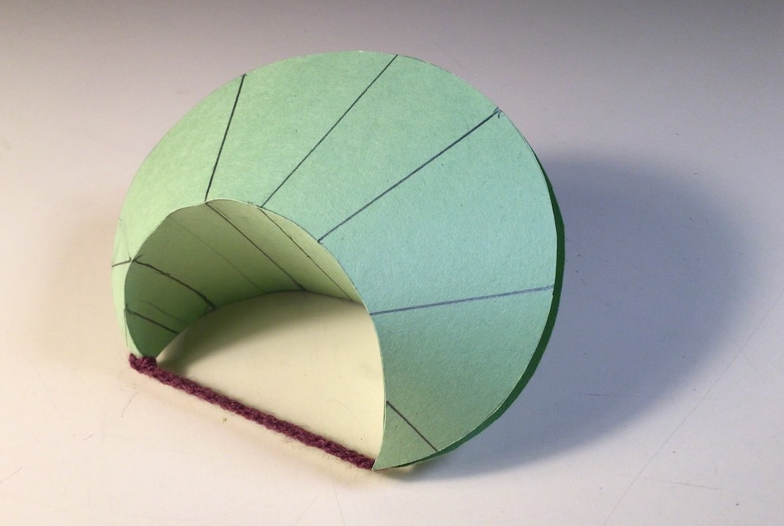 a folded diuble horn shape, made from the vesica piscis