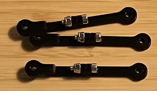 three black edges of the grid. There is metal hinge in the middle